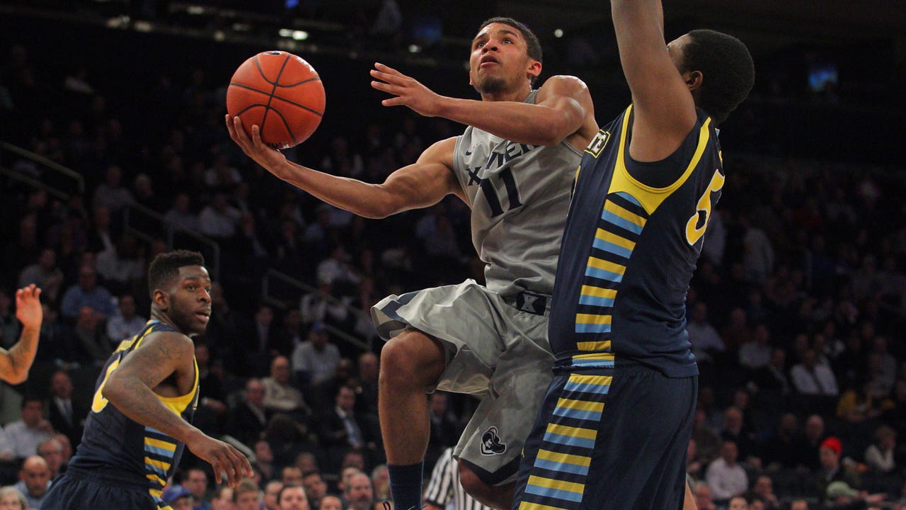 Xavier fights off Marquette, reaches Big East semifinals
